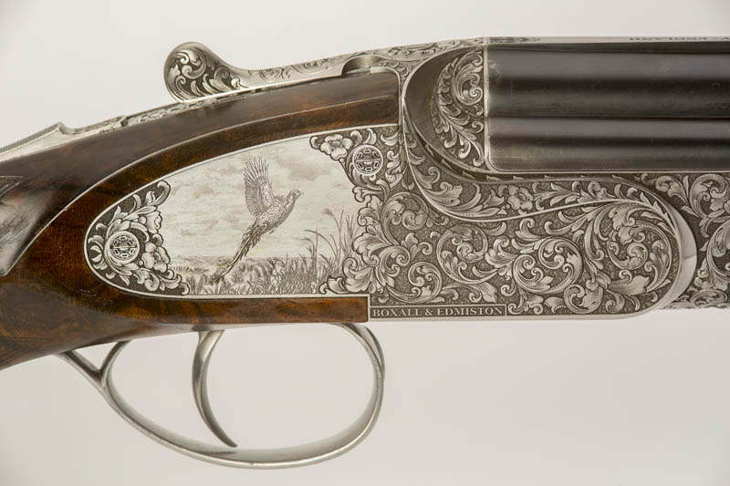 Pair of square sideplated 12 bore over and unders game scene Pair of square sideplated 12 bore over and unders game scene